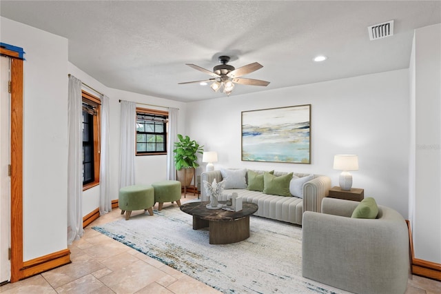 39427 Comstock Ln, Zephyrhills, FL 33540 - living room featuring baseboards, a ceiling fan, and recessed lighting