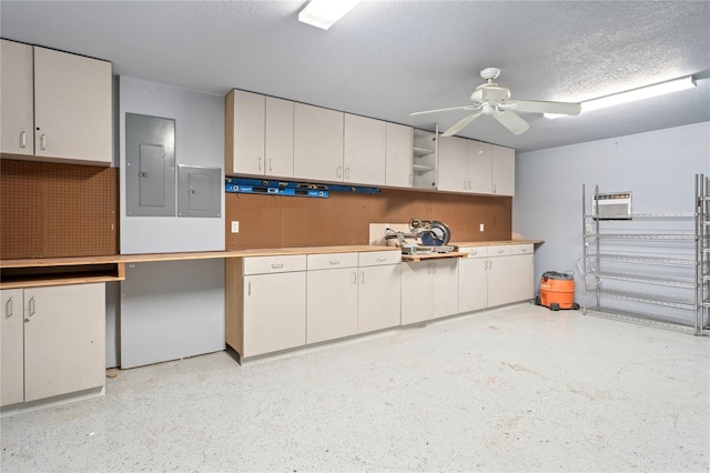 39427 Comstock Ln, Zephyrhills, FL 33540 - garage featuring ceiling fan and electric panel