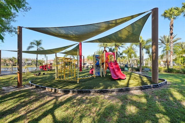 community playground with fence and a yard