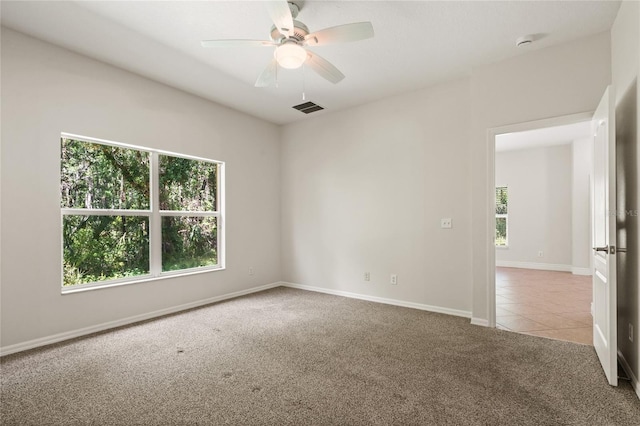 20221 Vintage Oaks Pl, Tampa, FL 33647 - tiled empty room with carpet flooring, ceiling fan, baseboards, and a smoke detector