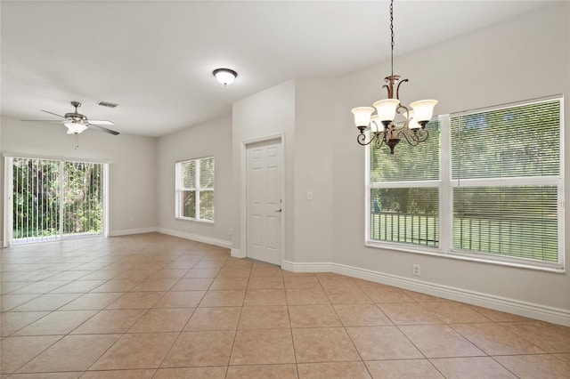 20221 Vintage Oaks Pl, Tampa, FL 33647 - spare room featuring light tile patterned flooring, a chandelier, ceiling fan, and baseboards