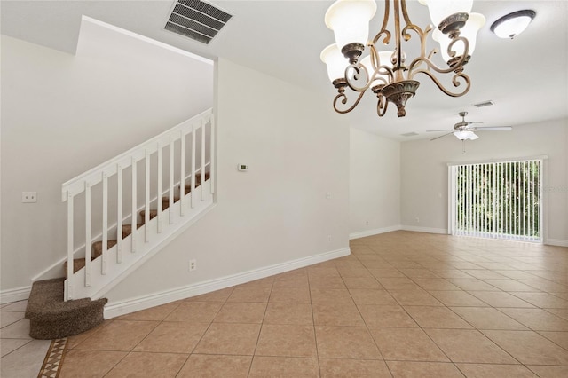 20221 Vintage Oaks Pl, Tampa, FL 33647 - spare room featuring light tile patterned flooring, a chandelier, a ceiling fan, and baseboards