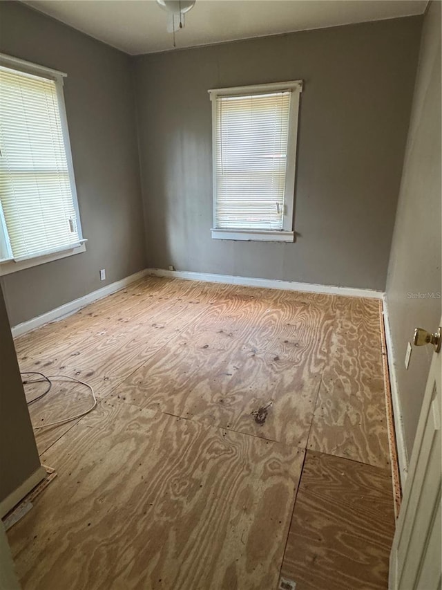 empty room with baseboards