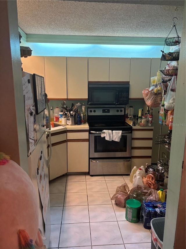 kitchen with light countertops, stainless steel range with electric stovetop, a textured ceiling, and black microwave