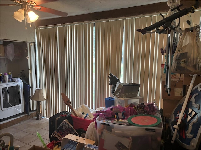 interior space featuring tile patterned flooring and ceiling fan