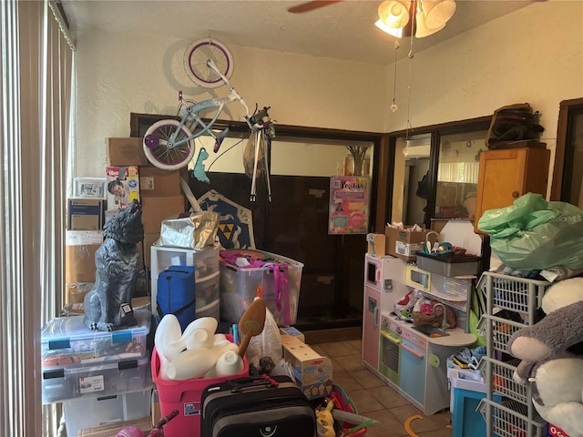 storage area with a ceiling fan