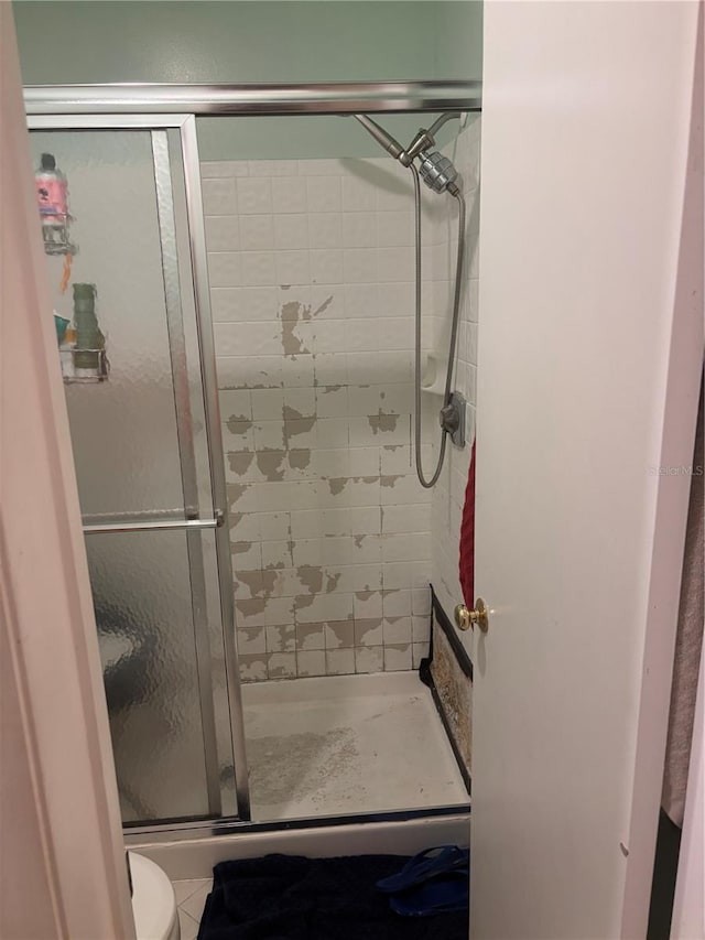 bathroom featuring a shower stall