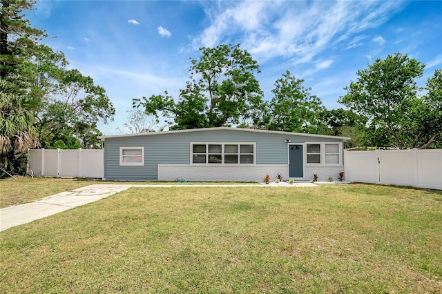 6601 13th St N, Saint Petersburg, FL 33702 - view of front of property featuring brick siding, a fenced backyard, and a front yard