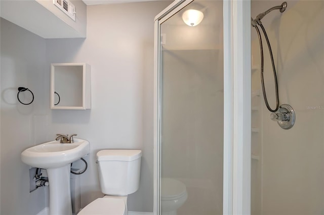 6601 13th St N, Saint Petersburg, FL 33702 - full bathroom with a sink, a shower stall, toilet, and visible vents