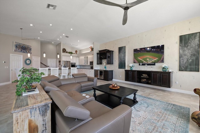 living area with ceiling fan, beverage cooler, recessed lighting, baseboards, and visible vents