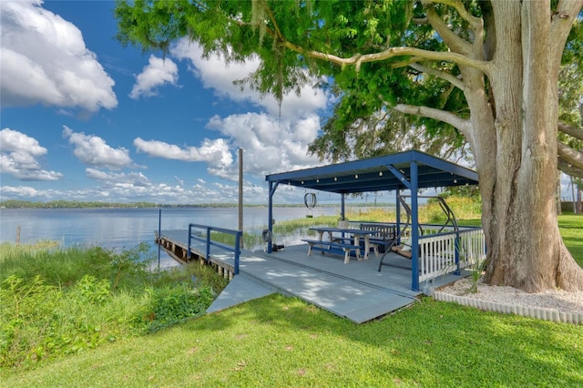 297 Lakeview Dr, Tarpon Springs, FL 34689 - dock area with a water view and a lawn