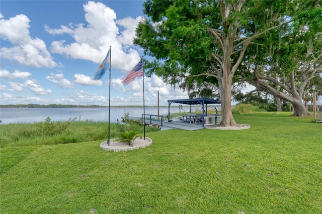 297 Lakeview Dr, Tarpon Springs, FL 34689 - view of green lawn featuring a water view
