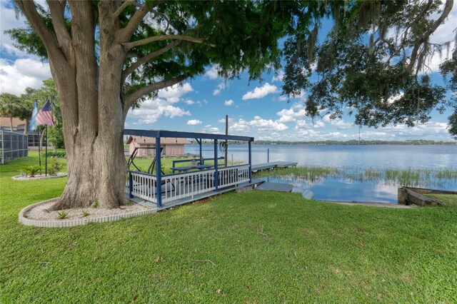 297 Lakeview Dr, Tarpon Springs, FL 34689 - dock area featuring a water view and a lawn