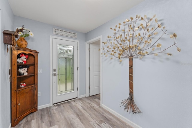 297 Lakeview Dr, Tarpon Springs, FL 34689 - entrance foyer featuring wood finished floors and baseboards
