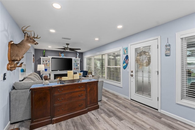 297 Lakeview Dr, Tarpon Springs, FL 34689 - living area with baseboards, healthy amount of natural light, light wood-style flooring, and recessed lighting