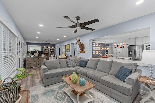 297 Lakeview Dr, Tarpon Springs, FL 34689 - living area featuring a ceiling fan, wood finished floors, recessed lighting, and a chandelier