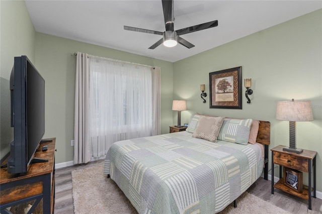 297 Lakeview Dr, Tarpon Springs, FL 34689 - bedroom featuring wood finished floors, baseboards, and ceiling fan