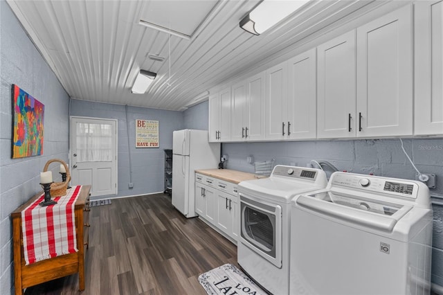 297 Lakeview Dr, Tarpon Springs, FL 34689 - washroom featuring cabinet space, independent washer and dryer, concrete block wall, and dark wood-type flooring