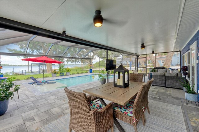 297 Lakeview Dr, Tarpon Springs, FL 34689 - sunroom with a ceiling fan, a pool, outdoor lounge area, and a water view