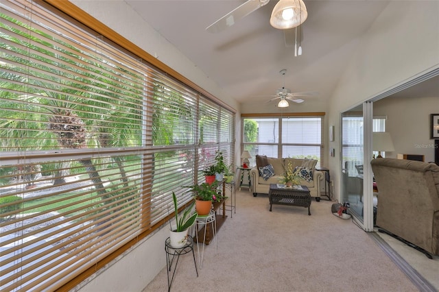 sunroom / solarium with a ceiling fan and an outdoor living space