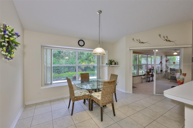 dining area featuring baseboards and light tile patterned floors