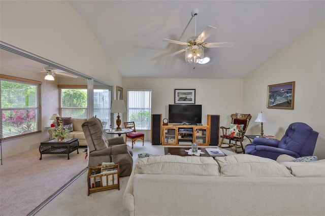 carpeted living area featuring a ceiling fan and lofted ceiling
