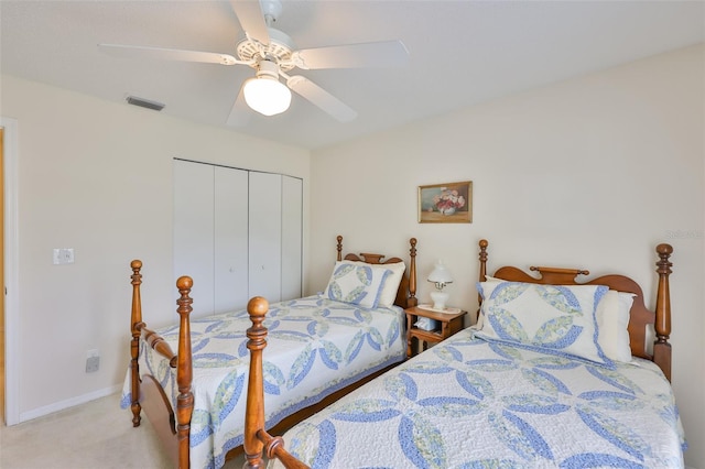 bedroom with ceiling fan, carpet, baseboards, visible vents, and a closet