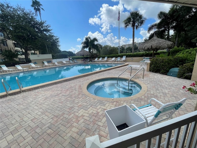 pool featuring a patio and a community hot tub