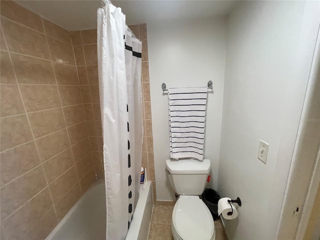 bathroom featuring tile patterned floors, shower / bath combo, and toilet