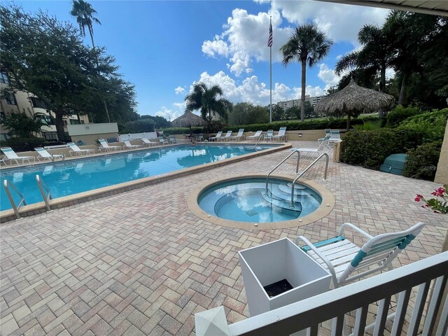 2615 Cove Cay Dr Unit 408, Clearwater, FL 33760 - community pool with a hot tub and a patio area