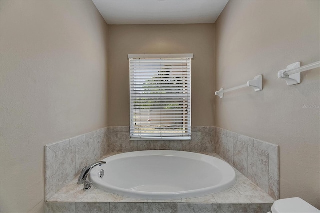 full bath with a bath and toilet