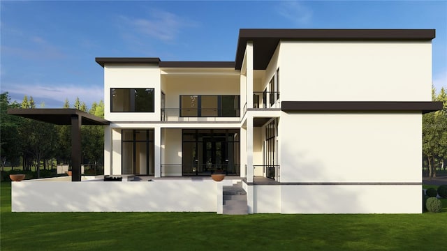 602 Channel Dr, Tampa, FL 33606 - rear view of property with a balcony, stucco siding, and a lawn