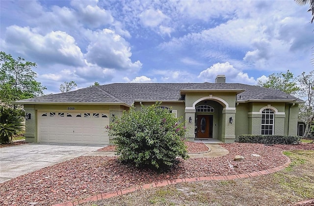 5058 Westlake Blvd, Dade City, FL 33523 - ranch-style house featuring concrete driveway, a garage, a chimney, stucco siding, and brick siding