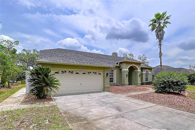 5058 Westlake Blvd, Dade City, FL 33523 - view of front of property with an attached garage, driveway, and a chimney