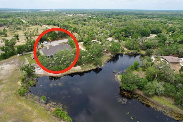 5058 Westlake Blvd, Dade City, FL 33523 - aerial overview of property's location featuring a heavily wooded area and a nearby body of water