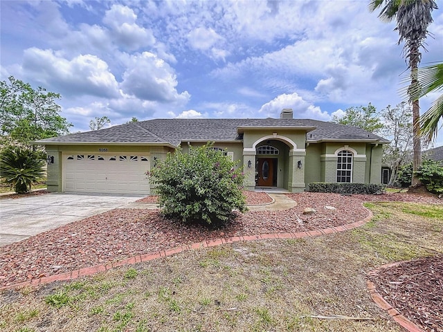 5058 Westlake Blvd, Dade City, FL 33523 - view of front of house featuring concrete driveway, an attached garage, stucco siding, and a chimney