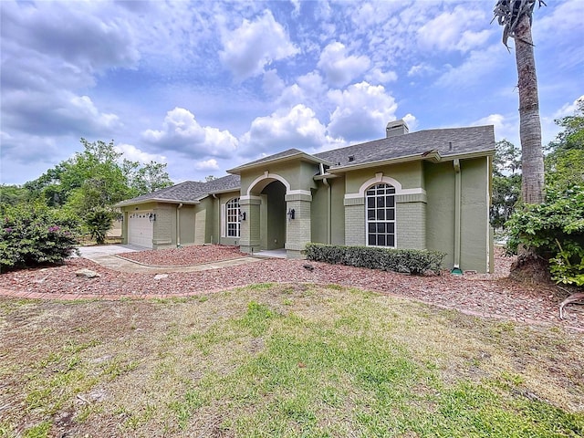 5058 Westlake Blvd, Dade City, FL 33523 - ranch-style home with an attached garage, a chimney, stucco siding, and driveway