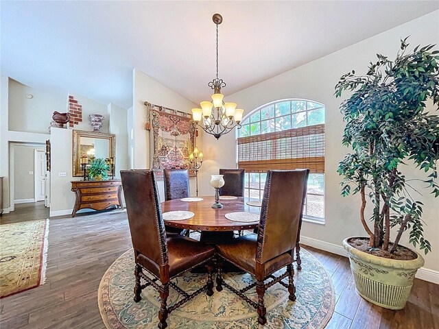 5058 Westlake Blvd, Dade City, FL 33523 - dining space featuring a chandelier, lofted ceiling, wood finished floors, and baseboards