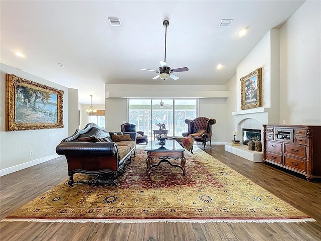5058 Westlake Blvd, Dade City, FL 33523 - living room with ceiling fan, wood finished floors, baseboards, and a glass covered fireplace