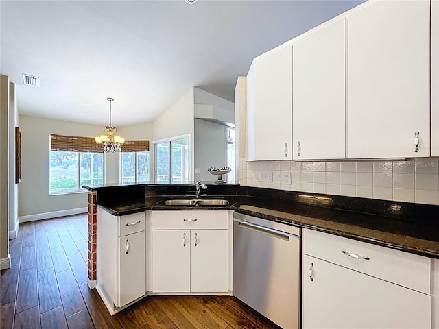 5058 Westlake Blvd, Dade City, FL 33523 - kitchen with stainless steel dishwasher, a sink, a chandelier, a peninsula, and dark wood-type flooring