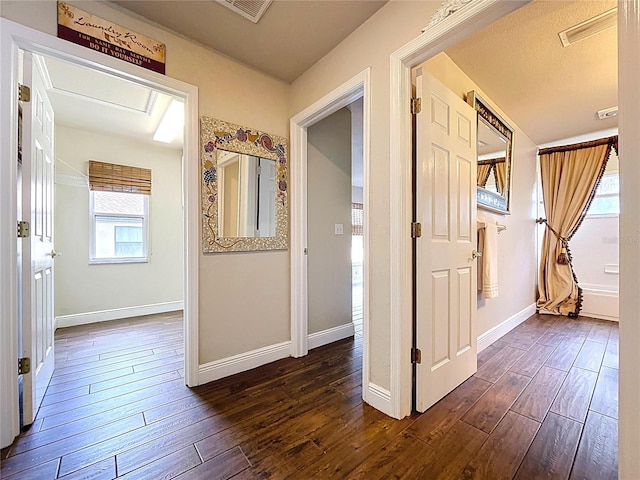 5058 Westlake Blvd, Dade City, FL 33523 - corridor featuring dark wood-style floors and baseboards