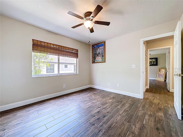5058 Westlake Blvd, Dade City, FL 33523 - spare room with dark wood-style flooring, a ceiling fan, baseboards, and a textured ceiling