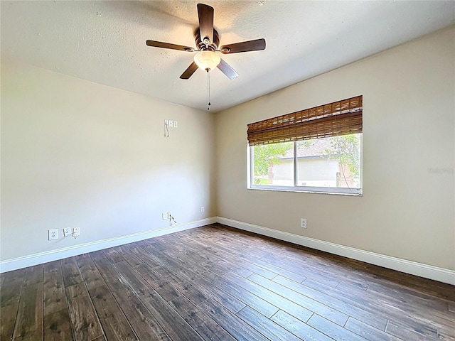 5058 Westlake Blvd, Dade City, FL 33523 - spare room with baseboards, a ceiling fan, dark wood finished floors, and a textured ceiling