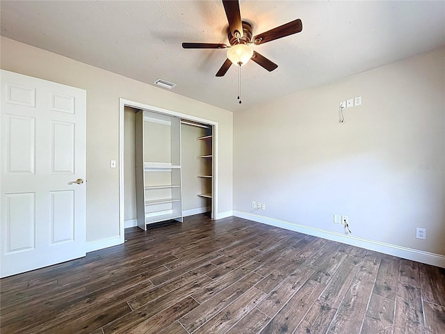 5058 Westlake Blvd, Dade City, FL 33523 - unfurnished bedroom with dark wood-style flooring, a closet, baseboards, and ceiling fan