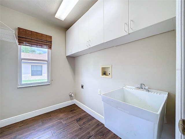 5058 Westlake Blvd, Dade City, FL 33523 - laundry area with washer hookup, cabinet space, dark wood finished floors, hookup for an electric dryer, and baseboards