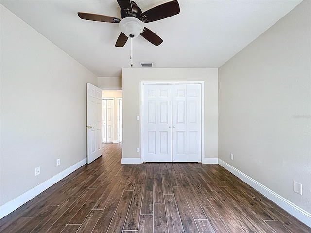 5058 Westlake Blvd, Dade City, FL 33523 - unfurnished bedroom with dark wood-style flooring, baseboards, a closet, and a ceiling fan