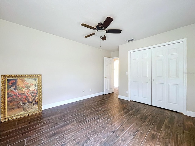 5058 Westlake Blvd, Dade City, FL 33523 - unfurnished bedroom featuring dark wood-style floors, baseboards, and a closet