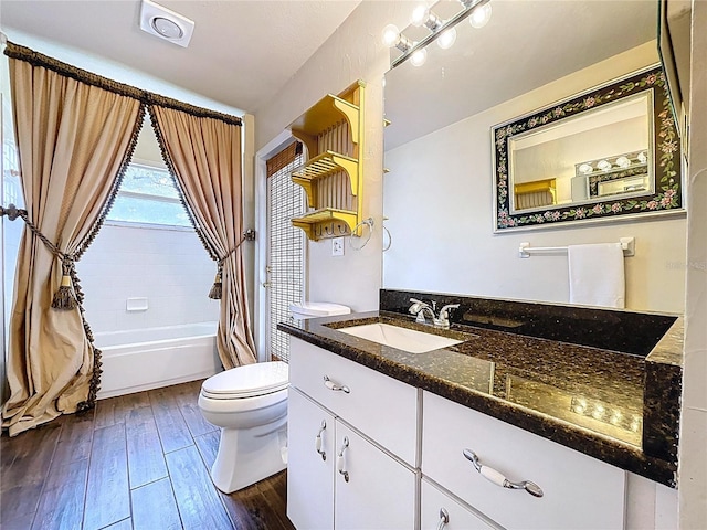 5058 Westlake Blvd, Dade City, FL 33523 - bathroom with toilet, hardwood / wood-style flooring, vanity, and shower / bathtub combination with curtain