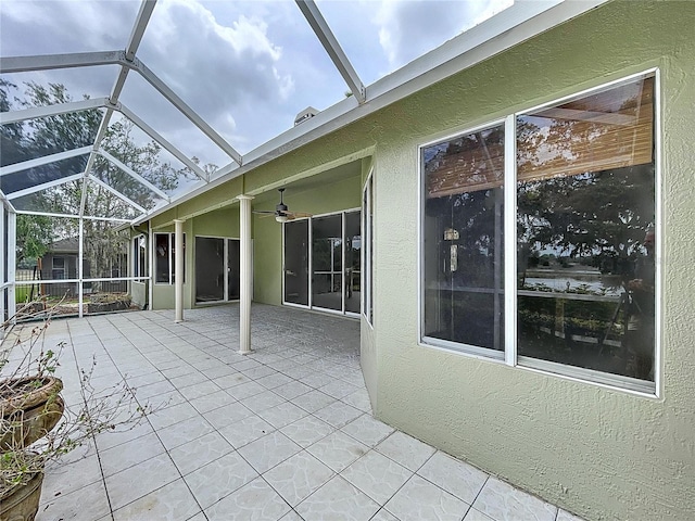 5058 Westlake Blvd, Dade City, FL 33523 - view of patio with a ceiling fan and glass enclosure