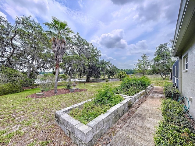 5058 Westlake Blvd, Dade City, FL 33523 - view of grassy yard with a vegetable garden